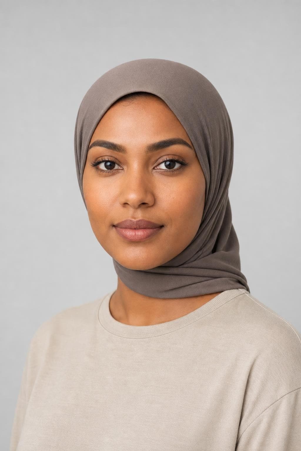 Yasmine, fictional AI fashion model: woman, in their thirties, wearing a hijab
